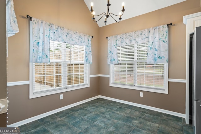 15 Livingston Way, Covington, GA 30016 - unfurnished dining area featuring a chandelier, vaulted ceiling, and baseboards