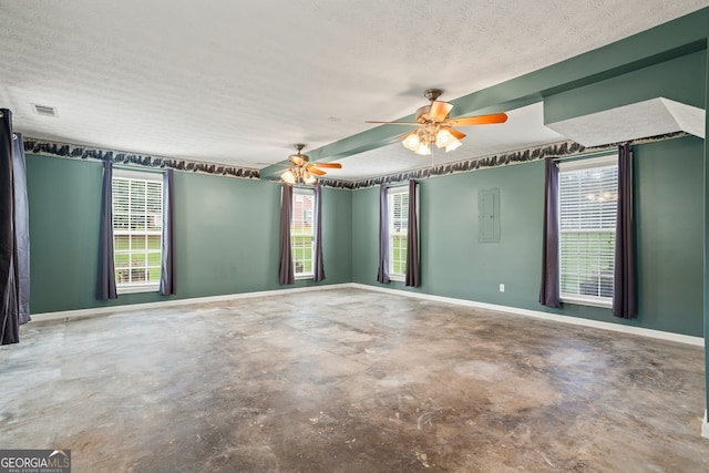 15 Livingston Way, Covington, GA 30016 - empty room featuring concrete flooring, baseboards, a textured ceiling, ceiling fan, and electric panel