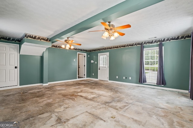 15 Livingston Way, Covington, GA 30016 - spare room featuring unfinished concrete flooring, baseboards, and a ceiling fan