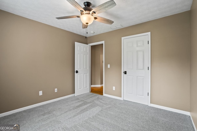15 Livingston Way, Covington, GA 30016 - unfurnished bedroom with carpet flooring, baseboards, ceiling fan, and a textured ceiling
