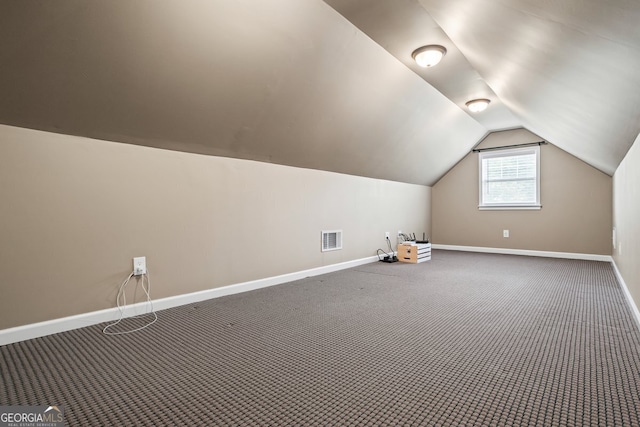 15 Livingston Way, Covington, GA 30016 - bonus room featuring baseboards, carpet, and lofted ceiling