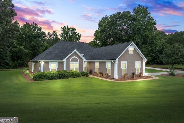 15 Livingston Way, Covington, GA 30016 - view of front of house featuring a yard and stucco siding
