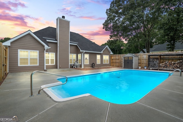 15 Livingston Way, Covington, GA 30016 - pool at dusk featuring a patio area and a fenced backyard
