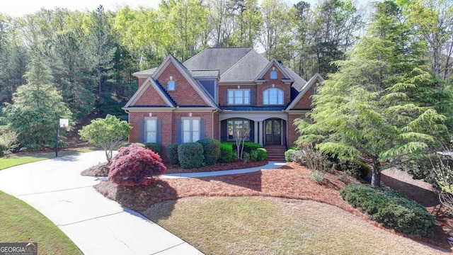 10125 Brixton Pl, Suwanee, GA 30024 - view of front of property with brick siding and covered porch