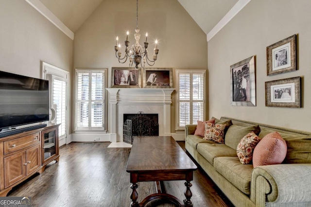 10125 Brixton Pl, Suwanee, GA 30024 - living area with a chandelier, a fireplace with flush hearth, high vaulted ceiling, dark wood-style flooring, and baseboards