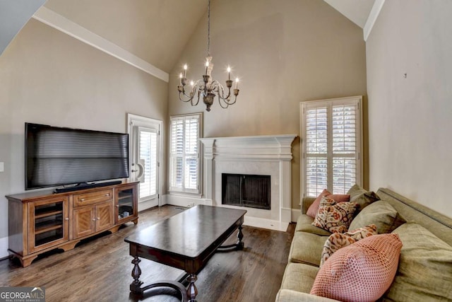 10125 Brixton Pl, Suwanee, GA 30024 - living room with a chandelier, high vaulted ceiling, dark wood finished floors, a premium fireplace, and baseboards