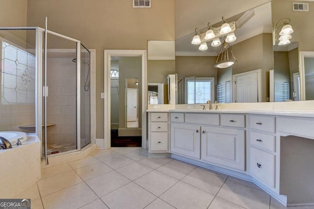 10125 Brixton Pl, Suwanee, GA 30024 - full bath featuring a shower stall, tile patterned floors, vanity, a bath, and crown molding