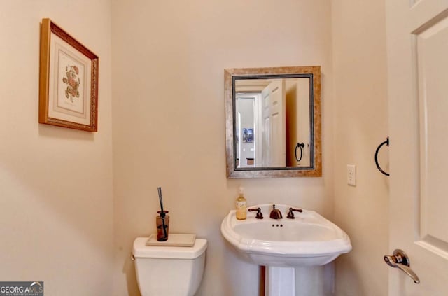 10125 Brixton Pl, Suwanee, GA 30024 - bathroom featuring toilet and a sink