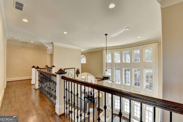10125 Brixton Pl, Suwanee, GA 30024 - corridor with an upstairs landing, baseboards, ornamental molding, recessed lighting, and wood finished floors