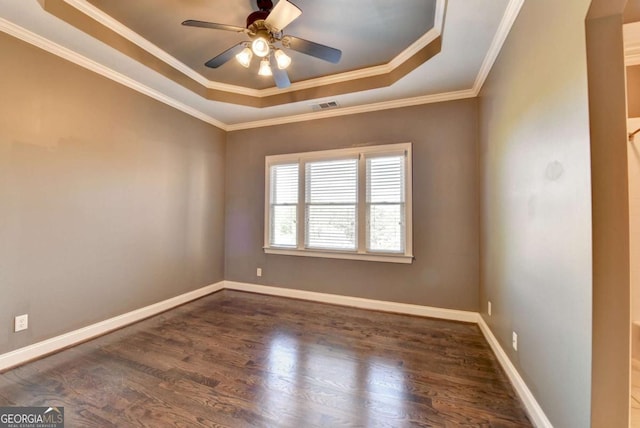 10125 Brixton Pl, Suwanee, GA 30024 - empty room with a raised ceiling, wood finished floors, a ceiling fan, baseboards, and ornamental molding