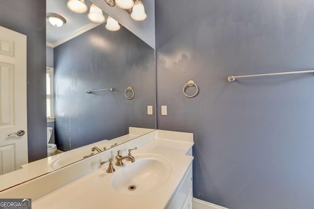 10125 Brixton Pl, Suwanee, GA 30024 - bathroom featuring toilet, vanity, and crown molding