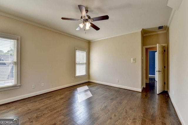 10125 Brixton Pl, Suwanee, GA 30024 - empty room featuring plenty of natural light, dark wood-type flooring, ornamental molding, a ceiling fan, and baseboards