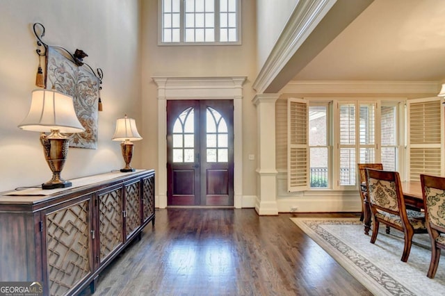 10125 Brixton Pl, Suwanee, GA 30024 - foyer entrance with wood finished floors, french doors, ornamental molding, decorative columns, and a high ceiling