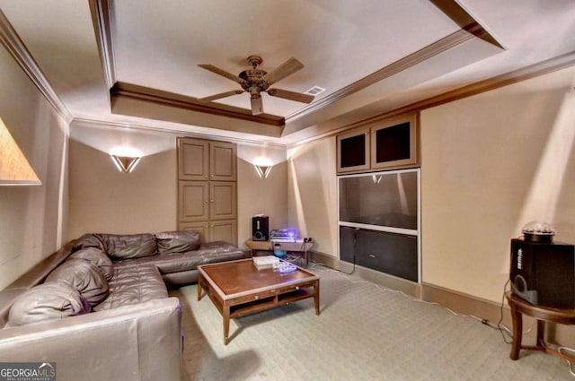 10125 Brixton Pl, Suwanee, GA 30024 - living area featuring crown molding, a tray ceiling, a ceiling fan, and carpet floors