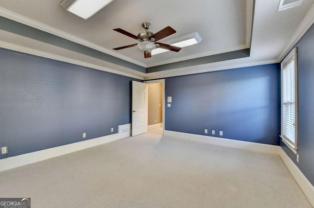 10125 Brixton Pl, Suwanee, GA 30024 - carpeted spare room with ceiling fan, a tray ceiling, crown molding, and baseboards