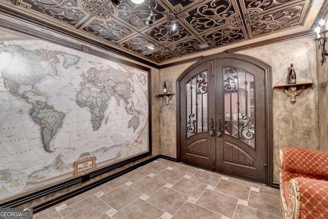 10125 Brixton Pl, Suwanee, GA 30024 - foyer entrance with arched walkways, french doors, crown molding, and an ornate ceiling