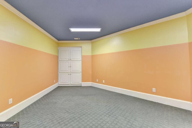 10125 Brixton Pl, Suwanee, GA 30024 - empty room featuring ornamental molding, dark colored carpet, and baseboards