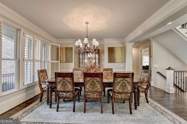 10125 Brixton Pl, Suwanee, GA 30024 - dining room featuring plenty of natural light, dark wood-style flooring, a chandelier, and crown molding