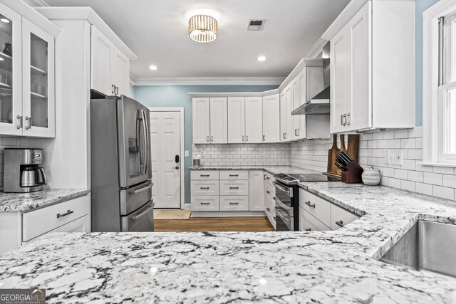25 Highlands Way, Oxford, GA 30054 - kitchen with stainless steel appliances, ornamental molding, white cabinetry, light wood finished floors, and recessed lighting
