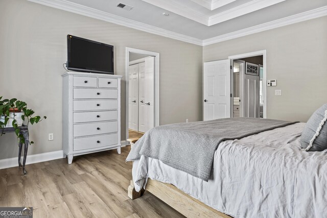 25 Highlands Way, Oxford, GA 30054 - bedroom with crown molding, light wood-style flooring, and connected bathroom