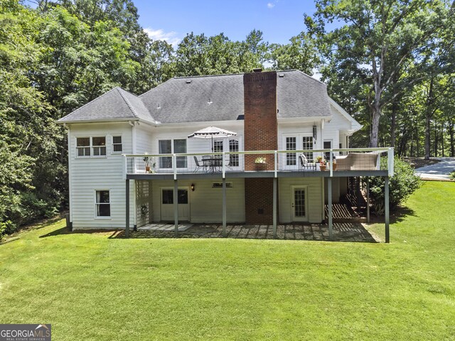 25 Highlands Way, Oxford, GA 30054 - rear view of house featuring a chimney, a yard, a patio, and a wooden deck