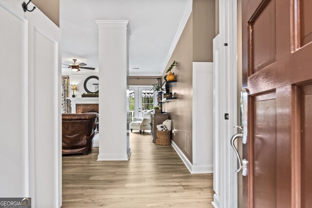 25 Highlands Way, Oxford, GA 30054 - foyer featuring a ceiling fan, light wood-style floors, crown molding, ornate columns, and french doors
