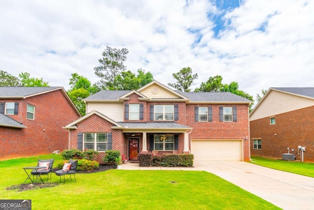 12275 Styron Dr, Hampton, GA 30228 - view of front of property featuring brick siding, an attached garage, concrete driveway, and a front yard
