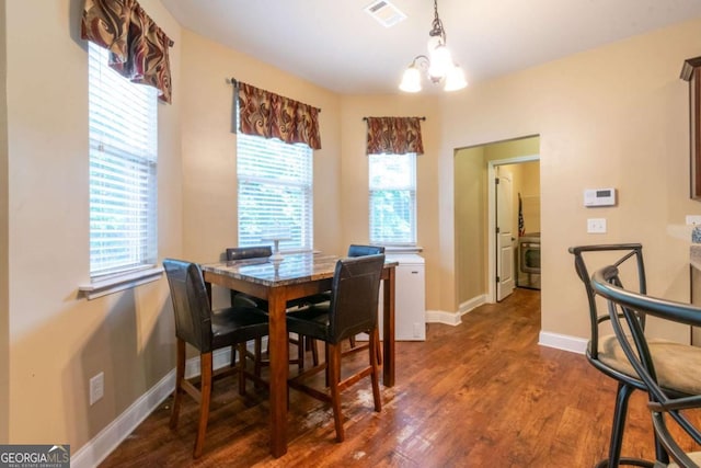 12275 Styron Dr, Hampton, GA 30228 - dining room featuring a chandelier and wood finished floors