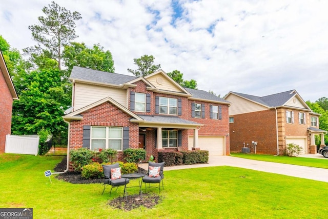 12275 Styron Dr, Hampton, GA 30228 - view of front of house featuring a garage, concrete driveway, and brick siding