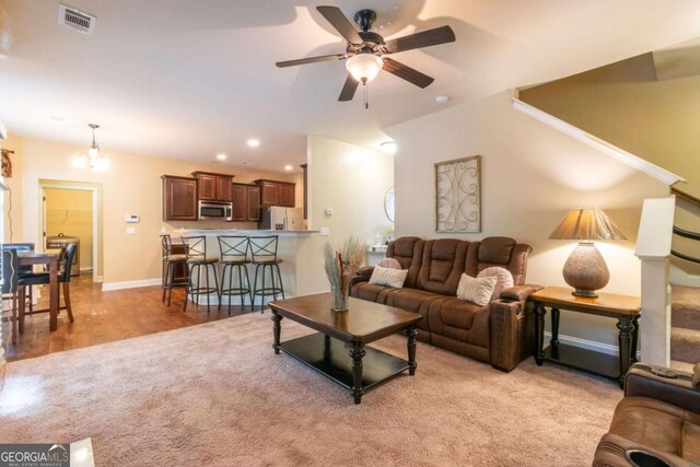 12275 Styron Dr, Hampton, GA 30228 - living area with a ceiling fan, light colored carpet, lofted ceiling, and recessed lighting