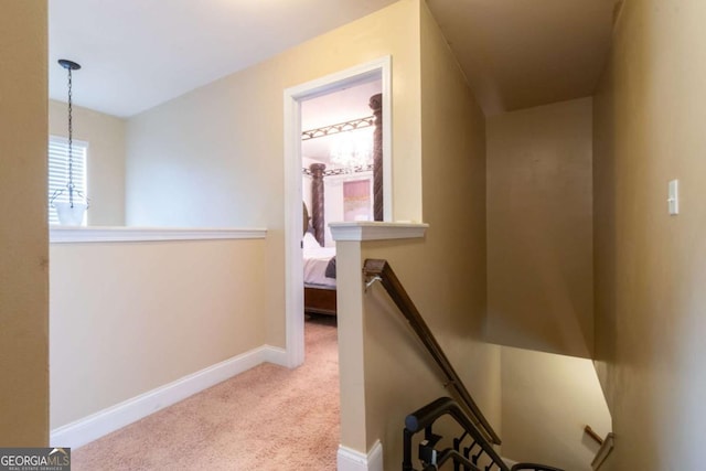 12275 Styron Dr, Hampton, GA 30228 - hallway with an upstairs landing, carpet flooring, and a chandelier