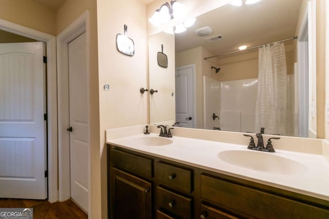12275 Styron Dr, Hampton, GA 30228 - bathroom featuring double vanity and a shower with curtain
