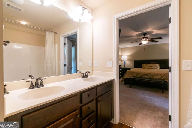 12275 Styron Dr, Hampton, GA 30228 - full bath with ensuite bath, double vanity, a ceiling fan, and a shower with curtain