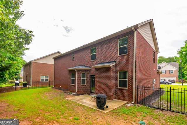 12275 Styron Dr, Hampton, GA 30228 - back of house with brick siding, a patio area, and a fenced backyard