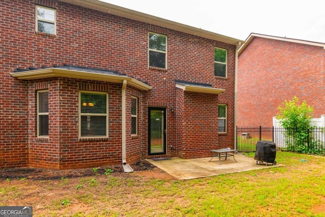 12275 Styron Dr, Hampton, GA 30228 - back of house featuring brick siding and a patio