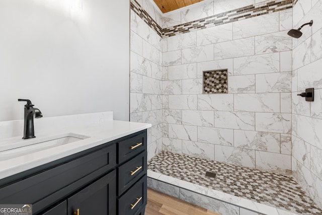 182 Cherry Rose Ln, Hartwell, GA 30643 - full bath featuring tiled shower, vanity, and wood finished floors
