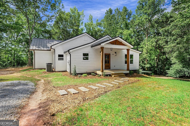 182 Cherry Rose Ln, Hartwell, GA 30643 - view of front of property with central AC unit, a front yard, and metal roof