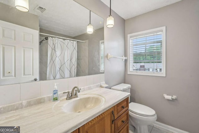 2201 Colonial Oak Way, Stone Mountain, GA 30087 - bathroom with vanity, toilet, curtained shower, and baseboards