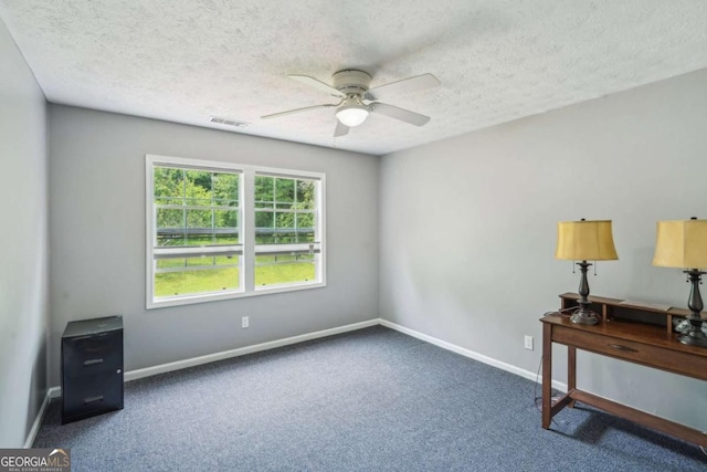 2201 Colonial Oak Way, Stone Mountain, GA 30087 - spare room featuring ceiling fan, carpet, baseboards, and a textured ceiling