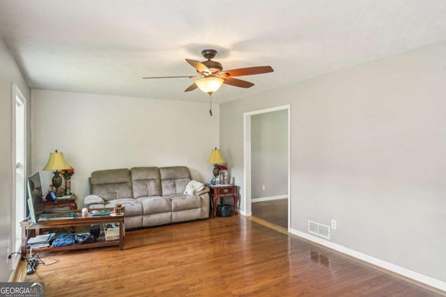 2201 Colonial Oak Way, Stone Mountain, GA 30087 - living area featuring ceiling fan, wood finished floors, and baseboards