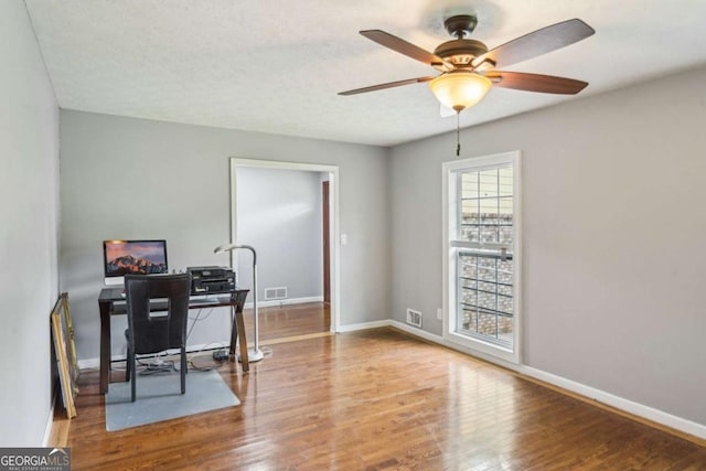2201 Colonial Oak Way, Stone Mountain, GA 30087 - office area featuring wood finished floors, ceiling fan, and baseboards
