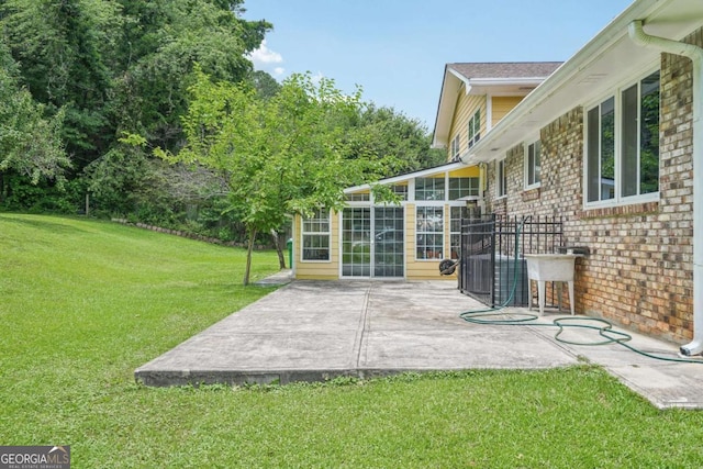 2201 Colonial Oak Way, Stone Mountain, GA 30087 - view of grassy yard featuring a patio area, a sunroom, and central air condition unit