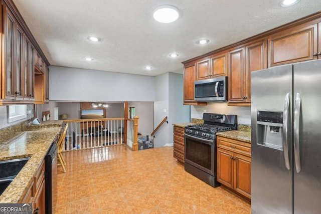 2201 Colonial Oak Way, Stone Mountain, GA 30087 - kitchen with appliances with stainless steel finishes, recessed lighting, light stone countertops, brown cabinetry, and a sink