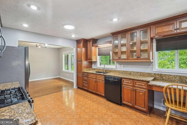 2201 Colonial Oak Way, Stone Mountain, GA 30087 - kitchen with black appliances, a sink, brown cabinetry, light stone counters, and recessed lighting