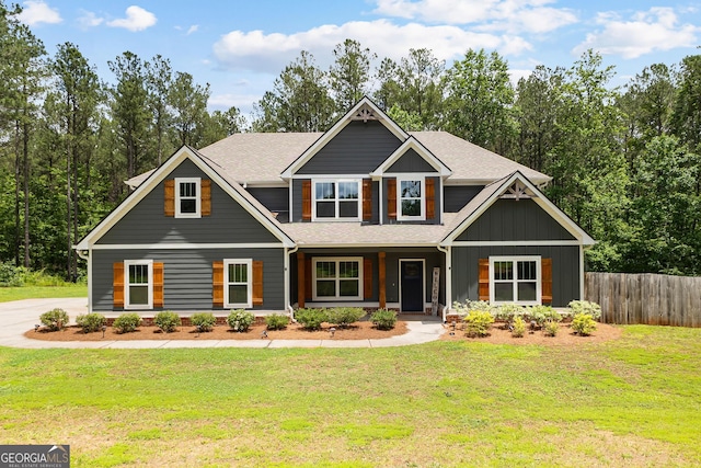 74 Riverwood Trl, Grantville, GA 30220 - craftsman-style house featuring covered porch, roof with shingles, and board and batten siding