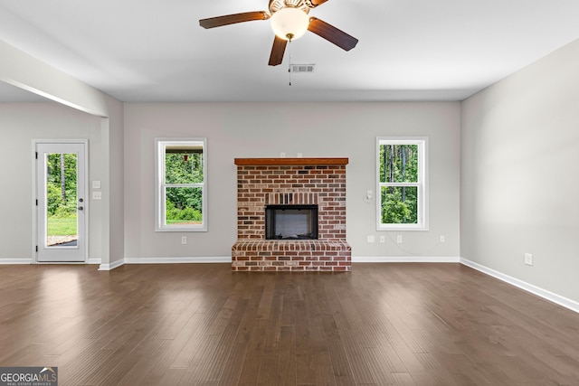 74 Riverwood Trl, Grantville, GA 30220 - unfurnished living room featuring a ceiling fan, dark wood-type flooring, and baseboards