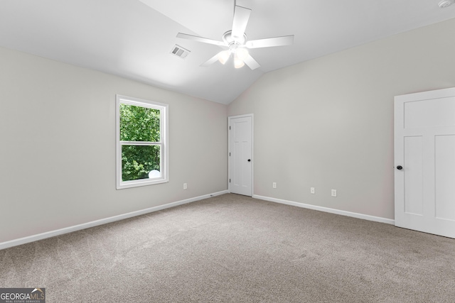 74 Riverwood Trl, Grantville, GA 30220 - spare room with ceiling fan, carpet floors, vaulted ceiling, and baseboards