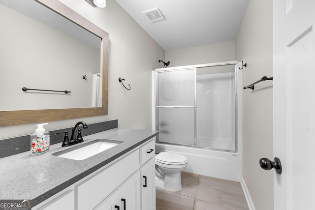 74 Riverwood Trl, Grantville, GA 30220 - full bath with vanity, toilet, tile patterned floors, shower / bath combination with glass door, and baseboards