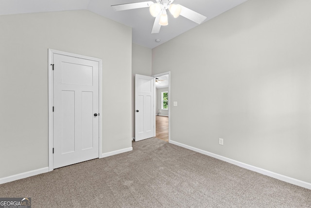 74 Riverwood Trl, Grantville, GA 30220 - unfurnished bedroom featuring carpet floors, lofted ceiling, baseboards, and ceiling fan