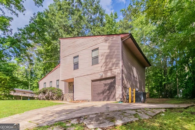 3851 Natalie Way, Ellenwood, GA 30294 - view of front of house featuring driveway, an attached garage, and a front lawn